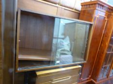 A TEAK SMALL BOOKCASE WITH GLASS SLIDING DOORS