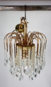MODERN GILT METAL AND GLASS CEILING LIGHT, the single bulb enclosed by three tiers of prism cut