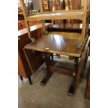 AN OAK DROP-LEAF DINING TABLE ON SLEDGE SUPPORTS