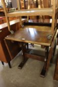 AN OAK DROP-LEAF DINING TABLE ON SLEDGE SUPPORTS
