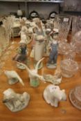 EIGHT VARIOUS LLADRO FIGURES AND ANIMAL ORNAMENTS TO INCLUDE; GIRL HOLDING A LAMB, GIRL CARRYING A