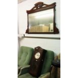 AN OVER MANTEL MIRROR IN MAHOGANY FRAME. TOGETHER WITH AN OAK CASED WALL CLOCK, HAVING GLAZED