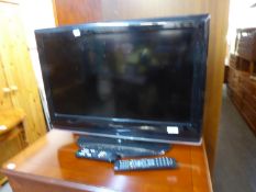 WHARFDALE 26” FLAT SCREEN TELEVISION, A SAGECOM FREESAT BOX AND A SONY VIDEO/DVD PLAYER, IN A YEW