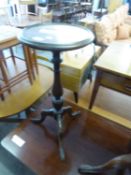 A GEORGE V MAHOGANY TRIPOD CIRCULAR TOP WINE TABLE