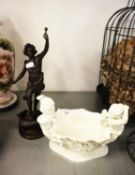 A CAST IRON, BRONZE EFFECT ALLEGORICAL FIGURE AND A WHITE POTTERY LOW PEDESTAL