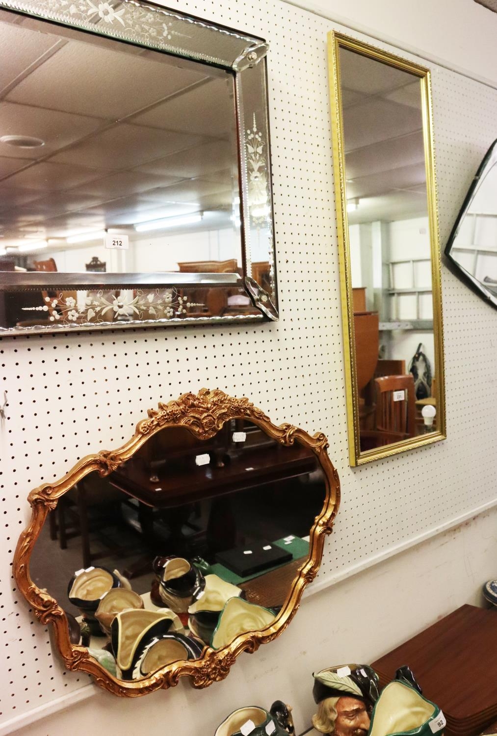 A GILT FRAMED SCALLOP SHAPED WALL MIRROR AND A RECTANGULAR WALL MIRROR IN GILT FRAME (2)  (94cm HIGH