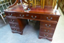 A REPRODUCTION MAHOGANY TWIN PEDESTAL DESK, HAVING RED LEATHER INSET TOP