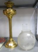 INTER-WAR YEARS BRASS COLUMNAR OIL LAMP with frosted glass shade and funnel, 25 ½" (65cm) high