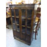 A LINEN FOLD CARVED OAK GLAZED DISPLAY CABINET