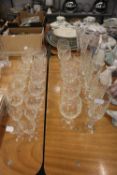 GOOD SELECTION OF CUT GLASS DRINKING GLASSES VARIOUS TO INCLUDE; TWO TALL CHAMPAGNE FLUTES, 5