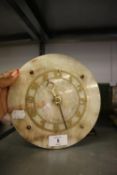 SMITHS ART DECO MANTEL CLOCK WITH CIRCULAR ONYX PANEL OVERLAID WITH A GILT METAL ARABIC CHAPTER