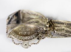 MIDDLE EASTERN FILIGREE SILVER AND NIELO WORK BRACELET with three pictorial panels and a silver