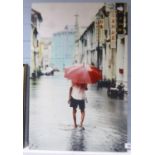 GEMMA FERNS (ROMILY) PHOTO LITHOGRAPH ON FABRIC 'RED UMBRELLA (MALAYSIA)' LABELLED VERSO, MOUNTED ON