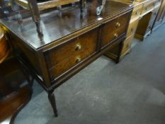 A MAHOGANY DRESSING TABLE WITH OBLONG MIRROR AND TWO SHORT OVER ONE LONG DRAWER, RAISED ON