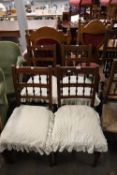 A SET OF FOUR HARDWOOD SPINDLE BACK SINGLE CHAIRS, WITH UPHOLSTERED SEATS