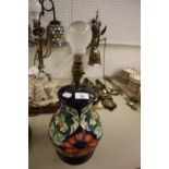 A MOORCROFT 'POPPY' PATTERN BALUSTER SHAPE TABLE LAMP