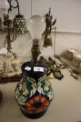 A MOORCROFT 'POPPY' PATTERN BALUSTER SHAPE TABLE LAMP