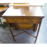 A SMALL MAHOGANY OBLONG GAMES/CARD TABLE HAVING SWIVEL AND FOLD-OVER TOP