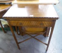 A SMALL MAHOGANY OBLONG GAMES/CARD TABLE HAVING SWIVEL AND FOLD-OVER TOP