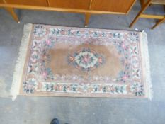 A WASHED CHINESE RUG, PINK AND FLORAL (170cm x 91cm)