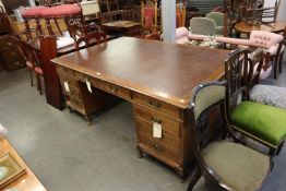 A LARGE TWIN PEDESTAL PARTNERS DESK, EACH PEDESTAL HAVING THREE DRAWERS AND CUPBOARDS TO THE
