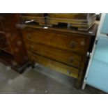 AN OAK CHEST OF THREE LONG DRAWERS