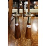 STYLISH PAIR OF TEAK CANDLESTICKS, each of tapering form with ELECTROPLATED HOLDERS, 8 ½” (21.6cm)