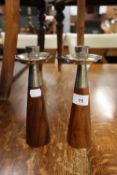 STYLISH PAIR OF TEAK CANDLESTICKS, each of tapering form with ELECTROPLATED HOLDERS, 8 ½” (21.6cm)