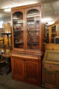A MAHOGANY CHIFFONIER BOOKCASE, THE UPPER SECTION HAVING TWO GLAZED DOORS WITH ADJUSTABLE SHELVES,