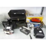 CANON POWERSHOT A560 DIGITAL CAMERA AND A CASED POLAROID INSTANT CAMERA AND A CASE, 2 ROLLS OF FILM,