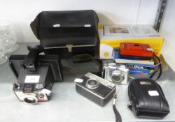 CANON POWERSHOT A560 DIGITAL CAMERA AND A CASED POLAROID INSTANT CAMERA AND A CASE, 2 ROLLS OF FILM,