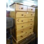 A MODERN PINE CHEST OF TWO SHORT AND FIVE LONG DRAWERS