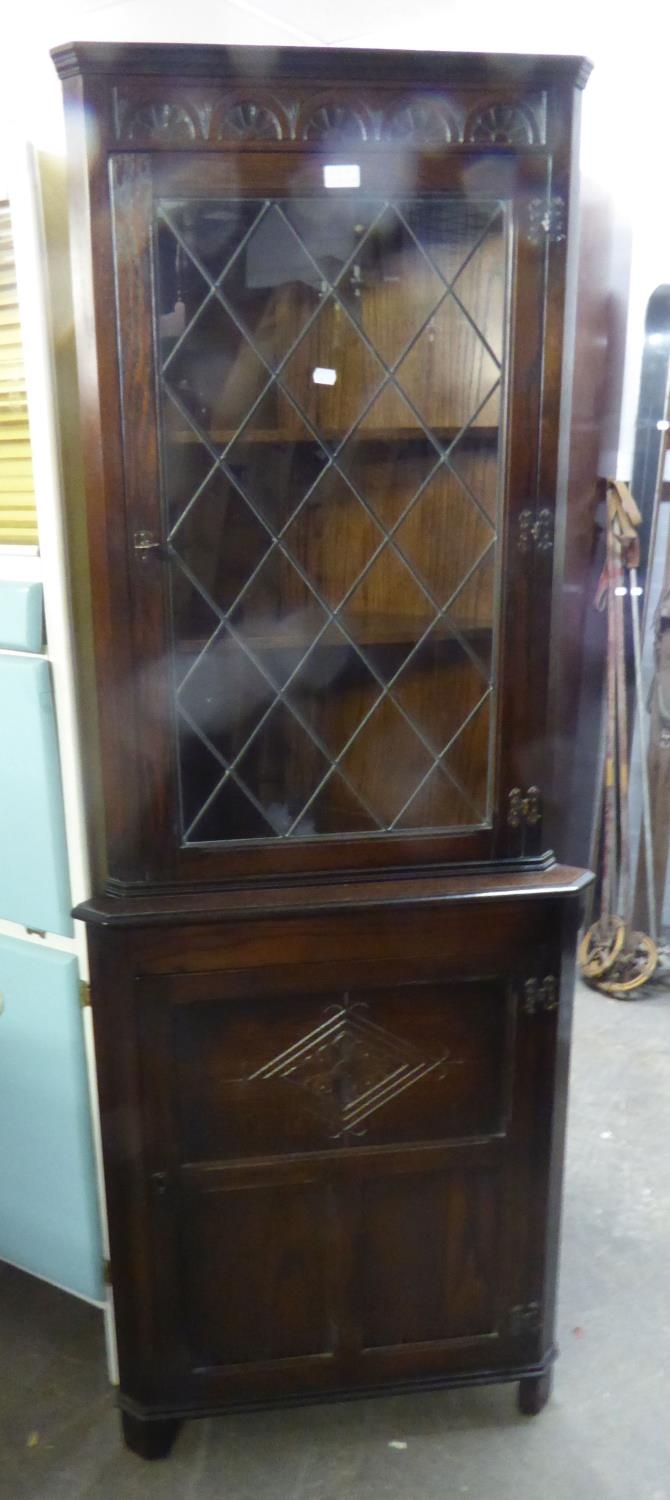 OAK FLOOR STANDING CORNER CABINET, HAVING LEADED GLAZED DOOR TO TOP SECTION AND CUPBOARD DOOR