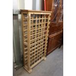 A 72 HOLE WOODEN WINE RACK