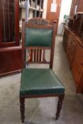 A SET OF FOUR EDWARD VII MAHOGANY DINING CHAIRS WITH COVERED GREEN LEATHER SEATS AND BACKS (4)