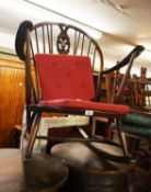 A DARK STAINED ERCOL ROCKING CHAIR