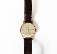 GENT'S MARVIN GOLD WRISTWATCH with mechanical movement, circular silvered dial with subsidiary