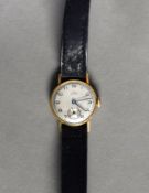 LADY'S 18ct GOLD CASED VINTAGE WRISTWATCH, with mechanical movement, silvered round arabic dial with