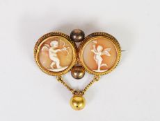 VICTORIAN GOLD COLOURED METAL DOUBLE CIRCLE AND SHELL CAMEO BROOCH, each depicting a cupid, with