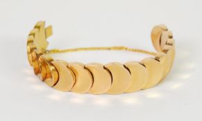 CONTINENTAL 18K GOLD BRACELET with 17 crescent shaped large panel links, with a safety chain, 52.