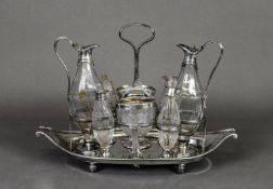 GEORGE III SILVER EIGHT BOTTLE CRUET STAND, of oval, two handled form with reeded borders, short,