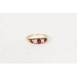 18ct GOLD DIAMOND AND RUBY RING, with a lozenge shaped setting of two small old cut diamonds,