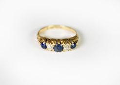 EARLY TWENTIETH CENTURY 18ct GOLD RING set with TWO SMALL DIAMONDS and THREE SAPPHIRES, 4.2 gms