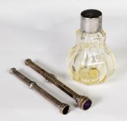 EARLY VICTORIAN PANELLED GLASS PEAR SHAPED PERFUME BOTTLE, with silver neck and silver pull-off top,