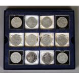 Box containing TWELVE ELIZABETH II CROWN COINS, including Guernsey 1998 brilliant, uncirculated FIVE