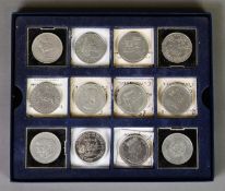 Box containing TWELVE ELIZABETH II CROWN COINS, including Guernsey 1998 brilliant, uncirculated FIVE