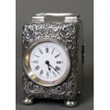 EDWARD VII EMBOSSED SILVER CASED SMALL CARRIAGE CLOCK, with 1 ½” white Roman dial and wind-up French