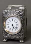 EDWARD VII EMBOSSED SILVER CASED SMALL CARRIAGE CLOCK, with 1 ½” white Roman dial and wind-up French