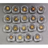 NINETEEN 14ct GOLD TINY (½gm) PROOF COMMEMORATIVE COINS, each 11mm diameter, (approximately ½”),