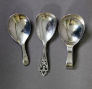 TWO SIMILAR SILVER CADDY SPOONS, each plain, with short handle, one with no assay office mark but